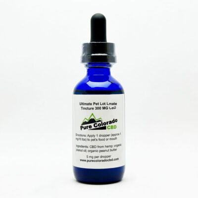 A blue tincture bottle of pet CBD oil with a white label.